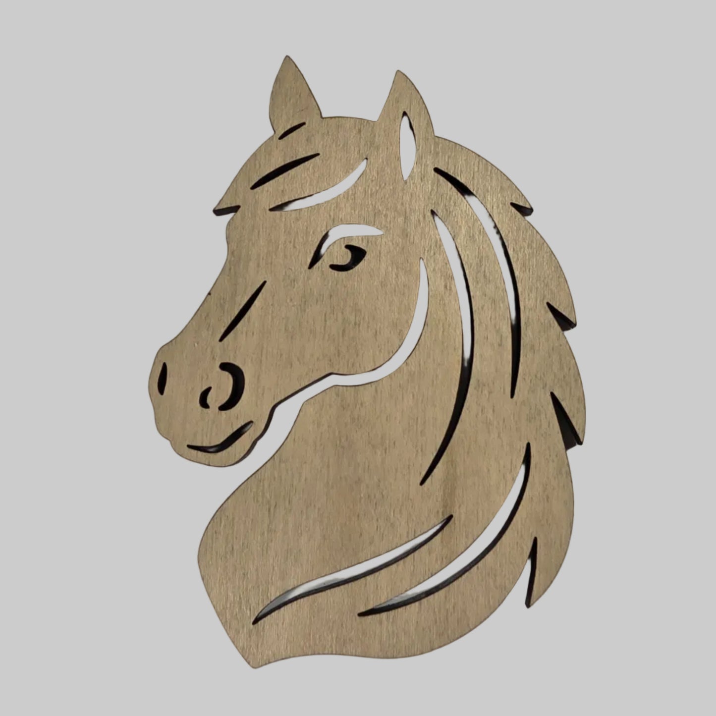 Wooden horse head cutout on a white background