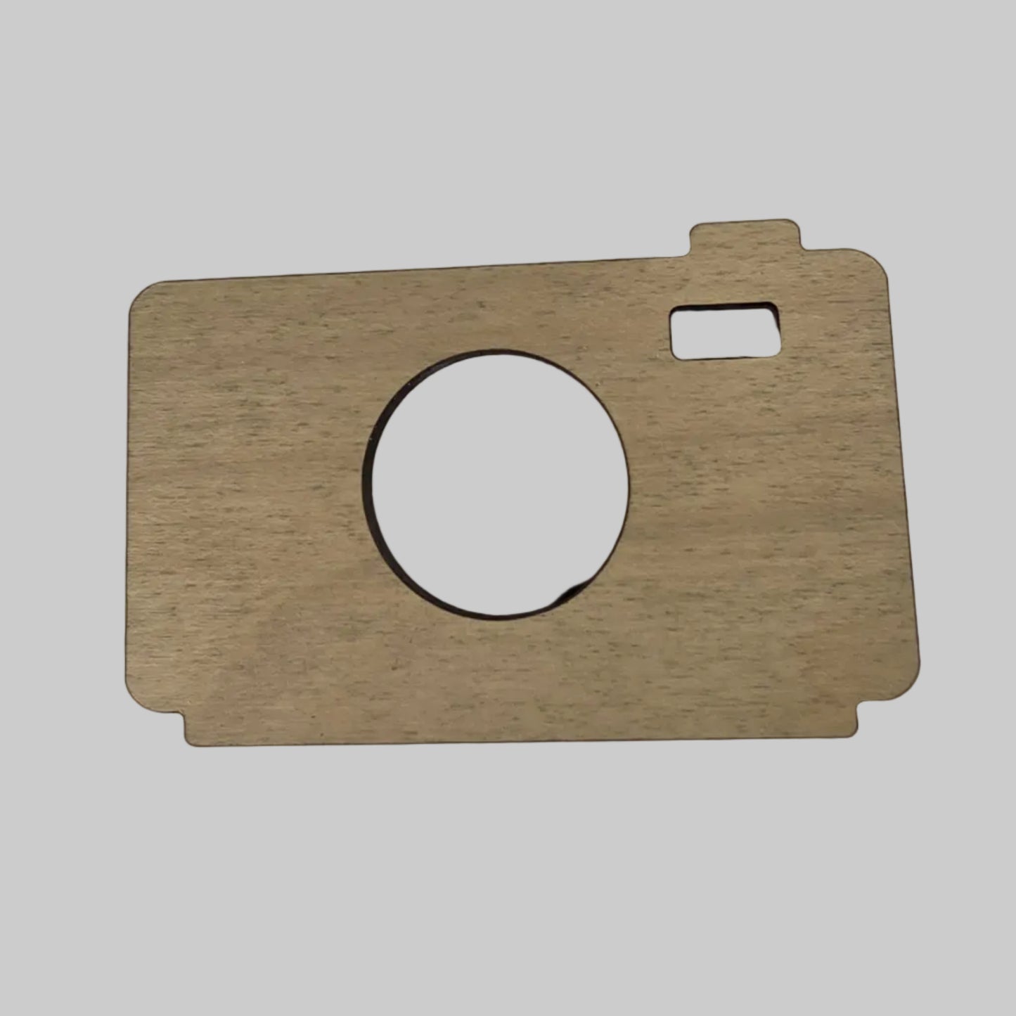 Wooden camera shape on a white background