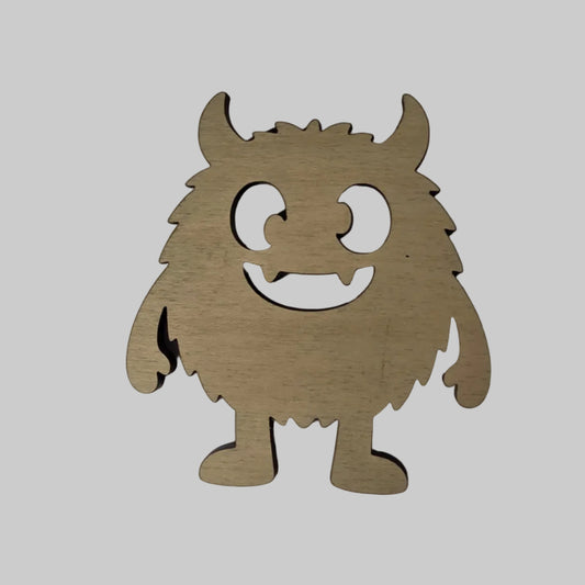 Wooden monster shaped cutout on a white background
