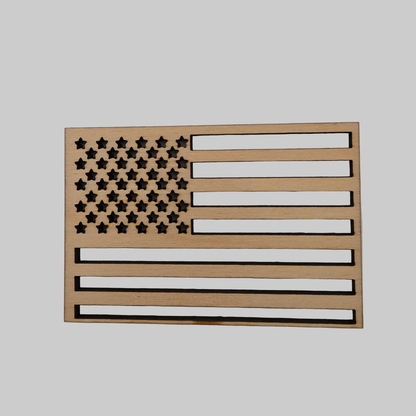 Wooden American flag wall art on a plain background