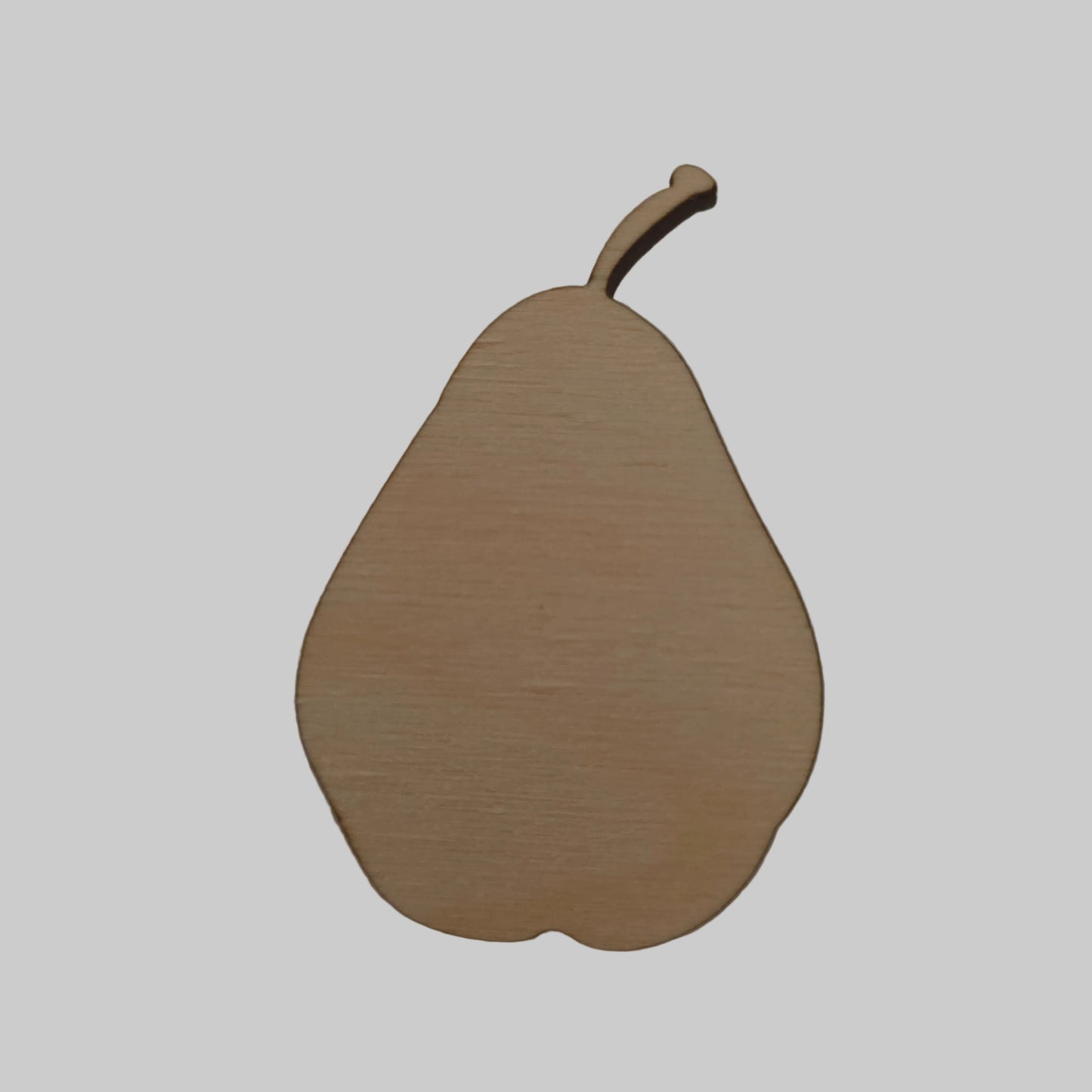 Wooden pear-shaped object on a beige background