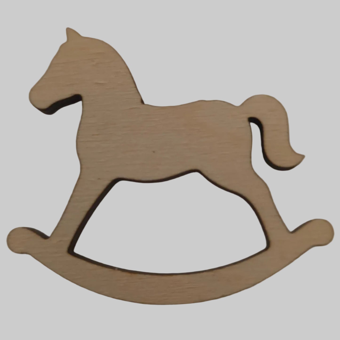 Wooden rocking horse and arrow silhouette on a beige background