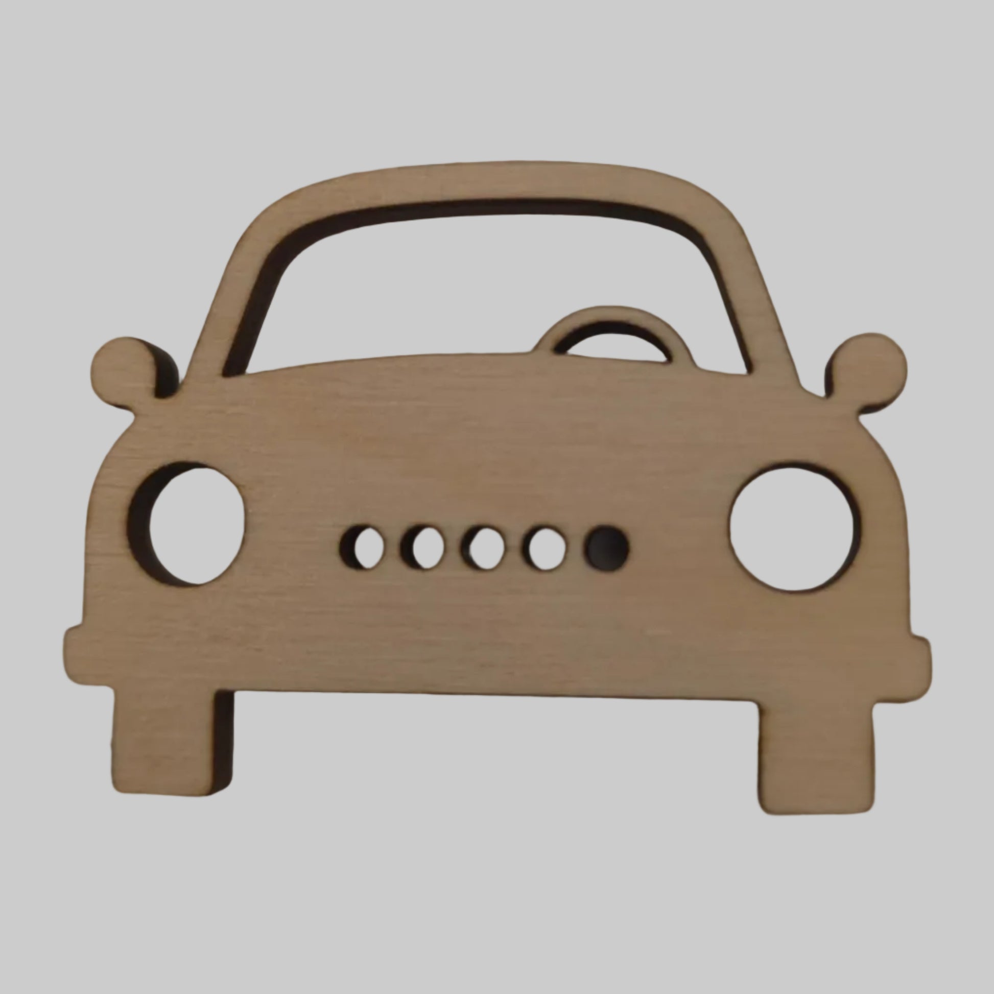 Wooden car-shaped cutout on a beige background