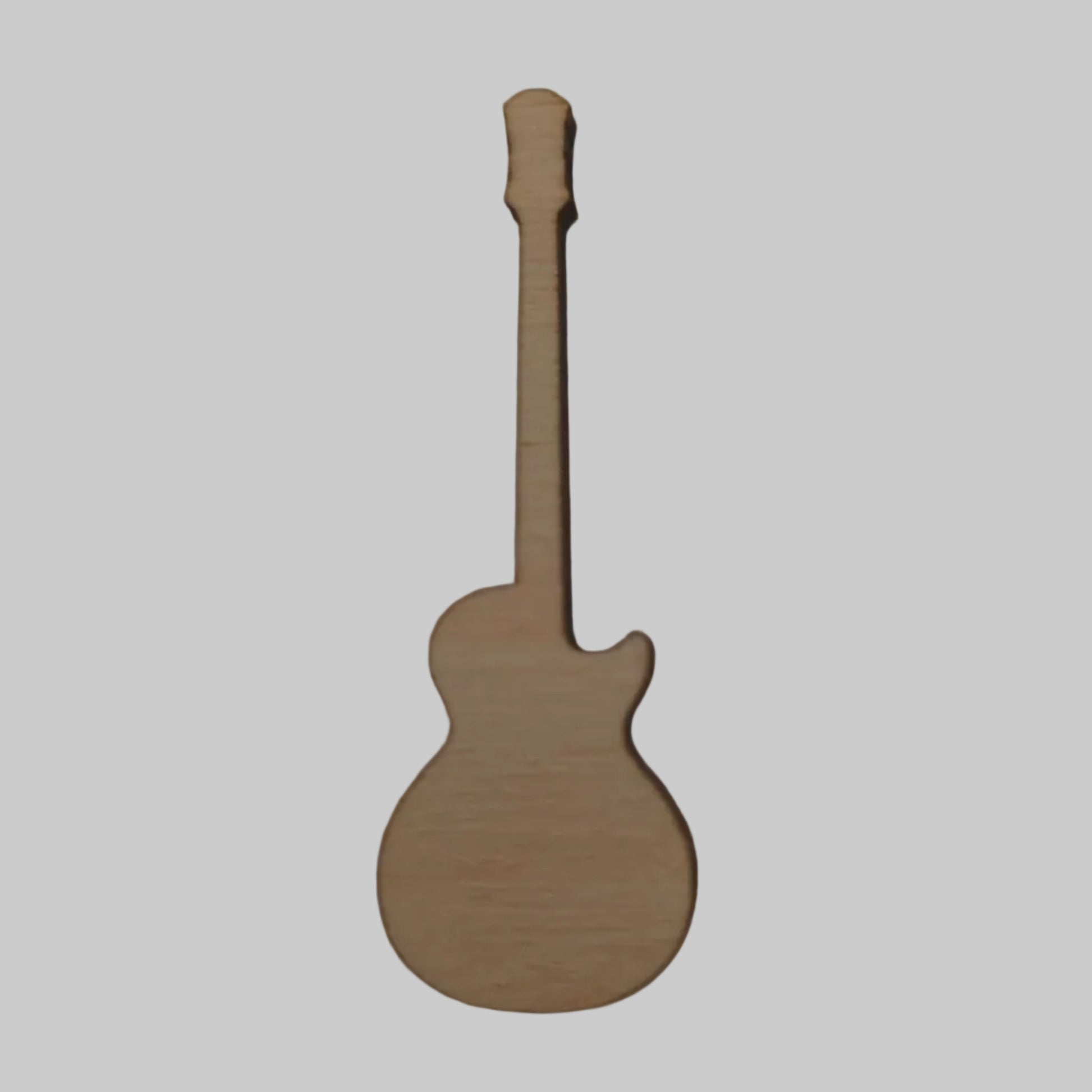 Wooden guitar model on a plain background