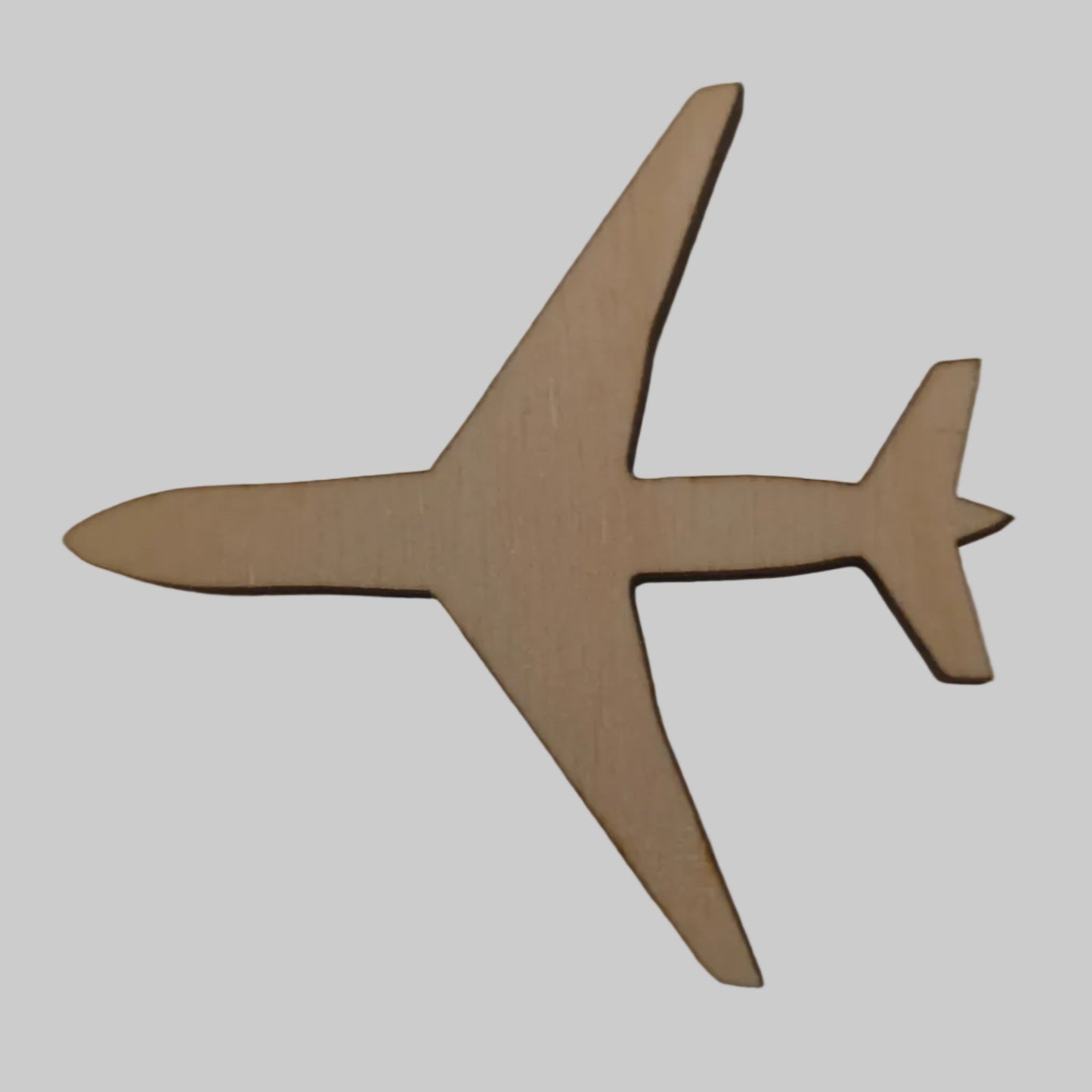 Wooden airplane model on a beige background